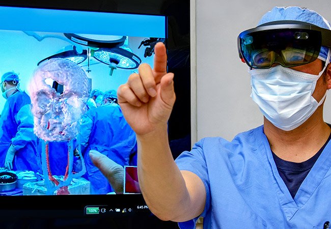 Augmented Reality in Surgery-first holographically navigated spine surgery